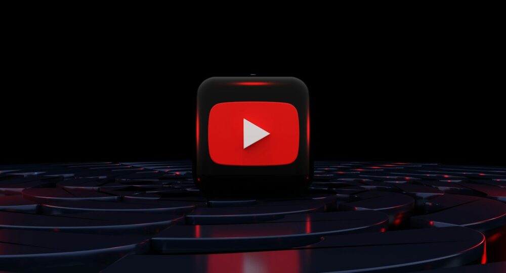 a red play button on a black background