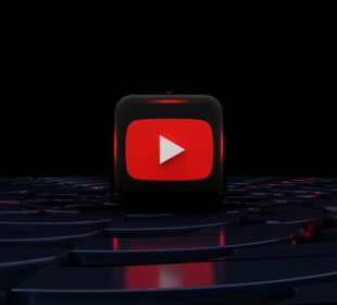 a red play button on a black background