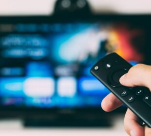 turned-on flat screen television