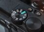 Close-up of a camera mode dial with settings.