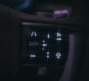 a close up of a car dashboard with buttons