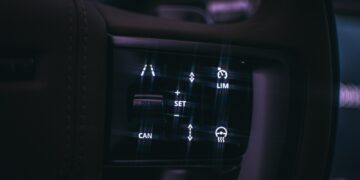 a close up of a car dashboard with buttons
