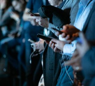 people using phone while standing