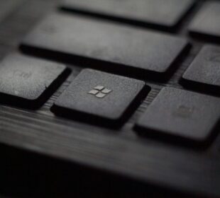 black laptop computer keyboard in closeup photo