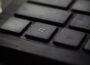 black laptop computer keyboard in closeup photo