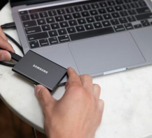 a person holding a laptop