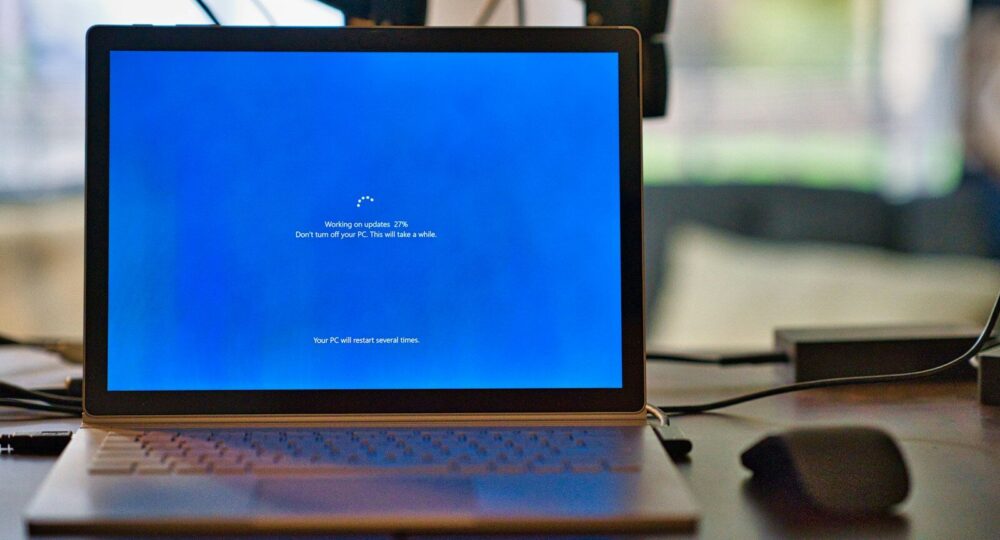 macbook pro on brown wooden table