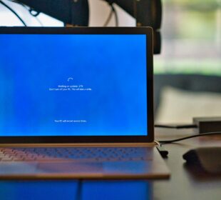 macbook pro on brown wooden table