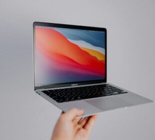 macbook pro on white table