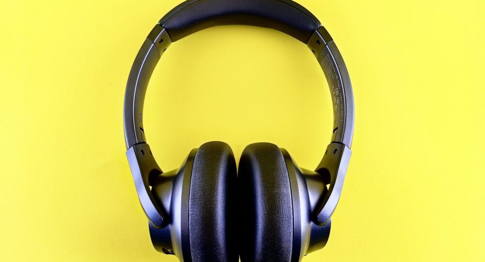 a pair of headphones on a yellow background