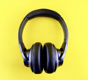 a pair of headphones on a yellow background