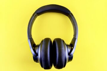 a pair of headphones on a yellow background