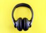 a pair of headphones on a yellow background