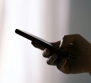 person holding black android smartphone