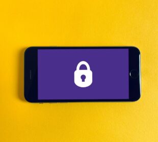 black iphone 5 on yellow textile