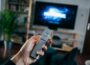 person holding gray remote control