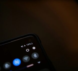 black remote control on white surface