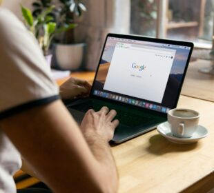 person using black laptop computer