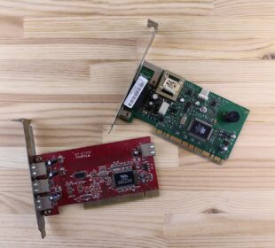 a raspberry board and a mouse on a wooden surface
