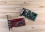a raspberry board and a mouse on a wooden surface