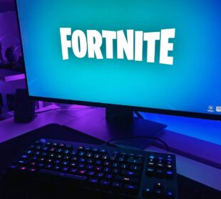 black flat screen computer monitor with black computer keyboard
