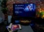 black flat screen tv turned on near brown brick wall