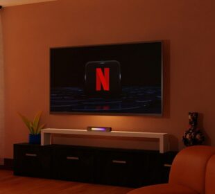 a living room with a flat screen tv on the wall
