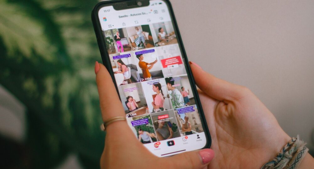 A person holding a cell phone in their hand