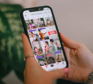 A person holding a cell phone in their hand