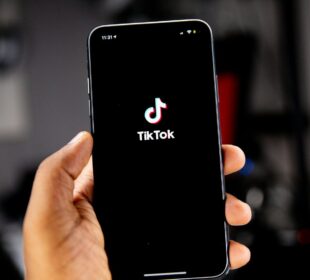person holding black iphone 5